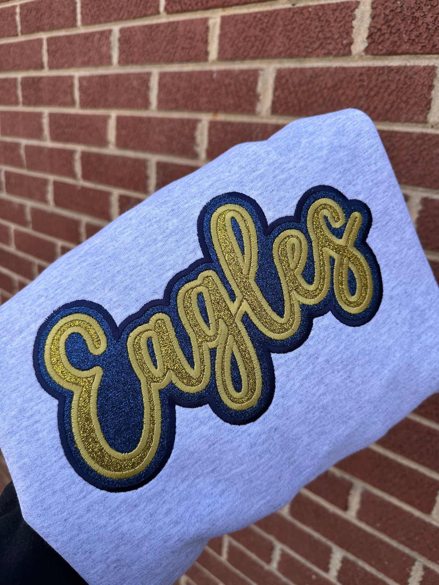 DOUBLE STACKED GLITTER MASCOT EAGLES (NAVY AND GOLD) GREY